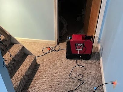 Water Damage Restoration in a Basement in Burlington Vermont - Air Mover and Dehumidifier